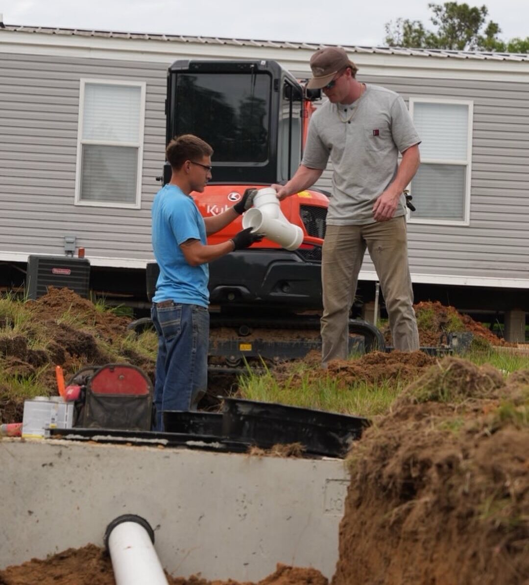 Honey Wagon crew installing septic lines