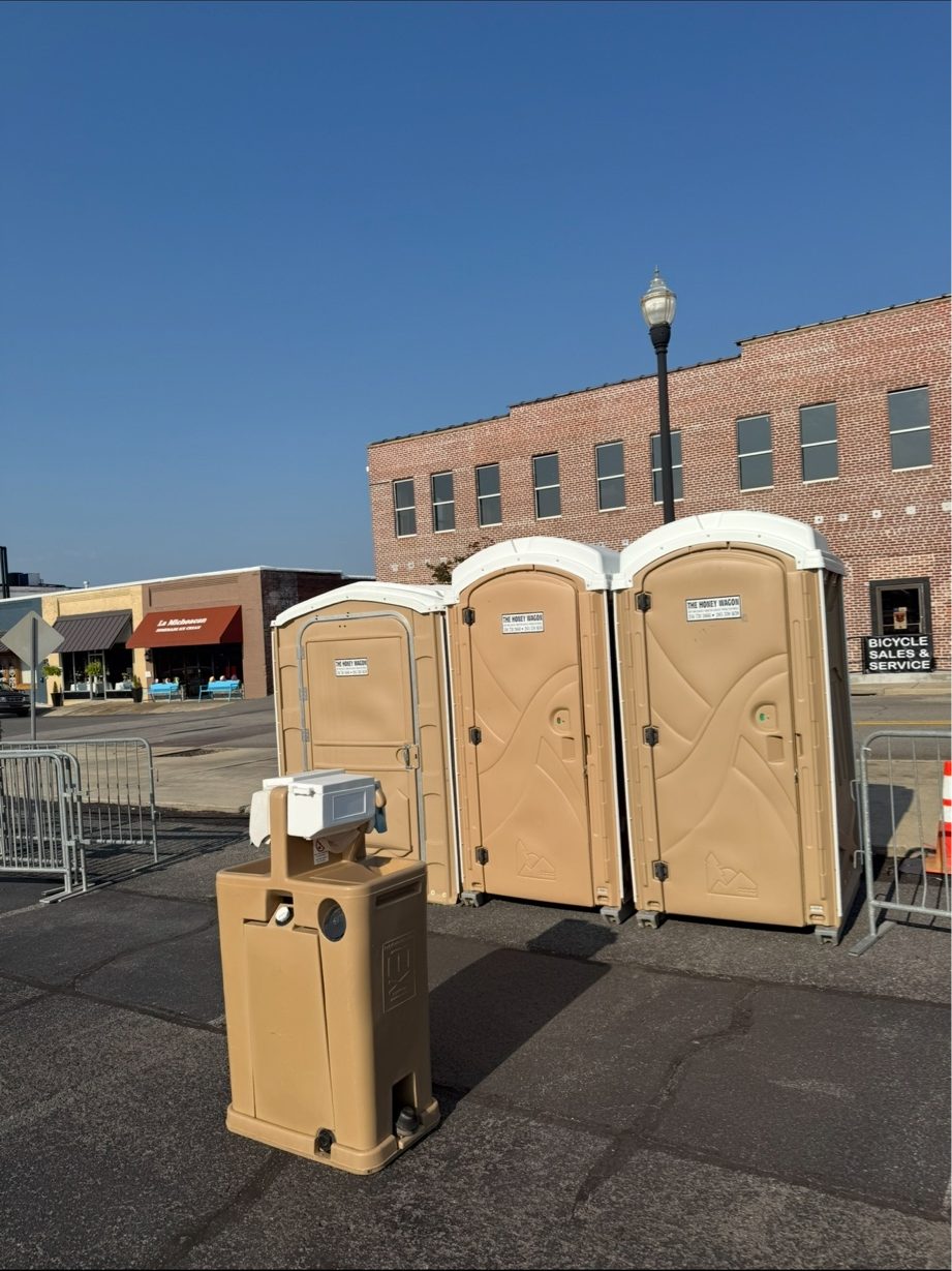 Honey Wagon portable restrooms and hand sink at a downtown event