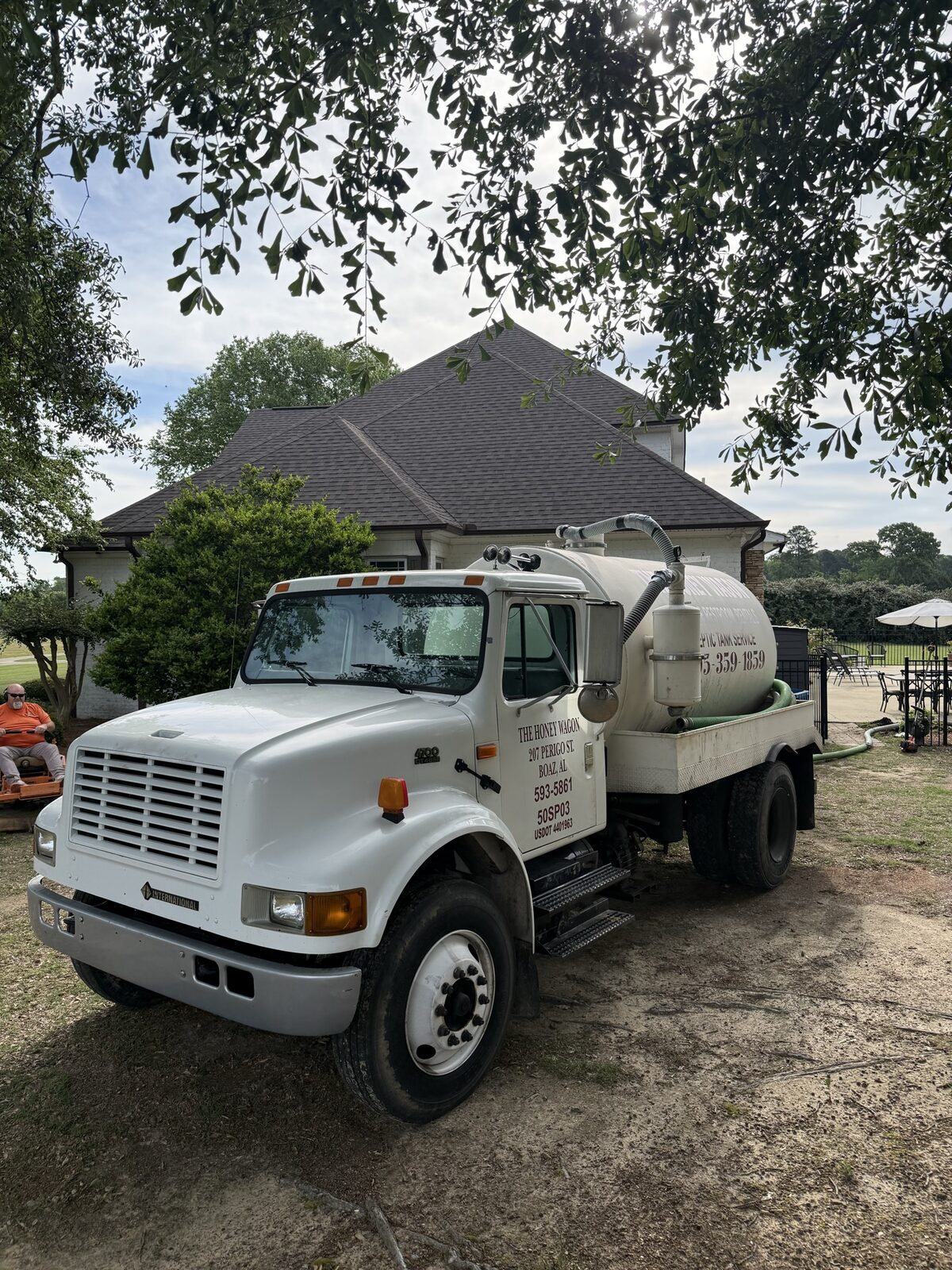 Honey Wagon pump truck servicing a home